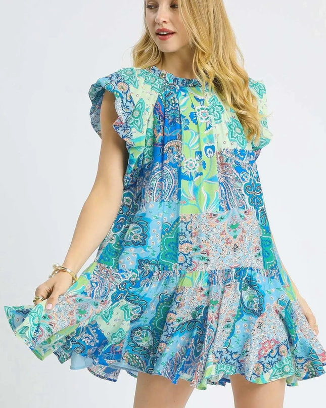 Woman wearing a colorful patterned dress on a white background
