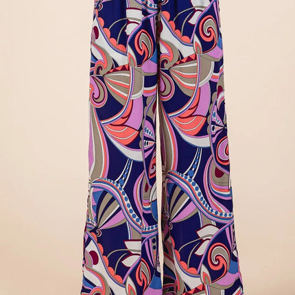Colorful patterned pants on a beige background