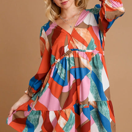Woman wearing a colorful dress  on a beige background