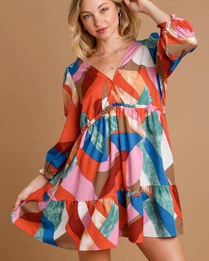 Woman wearing a colorful dress  on a beige background