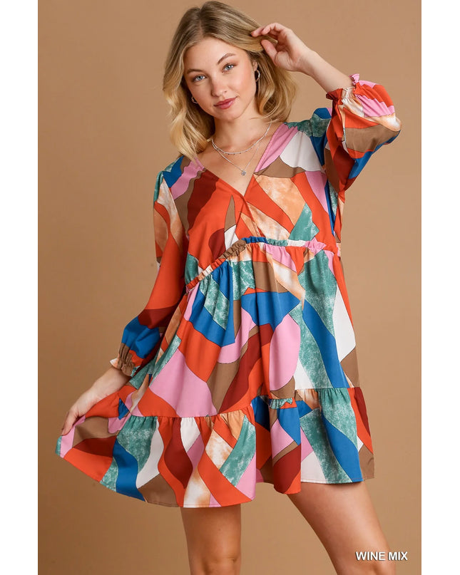 Woman wearing a colorful dress  on a beige background