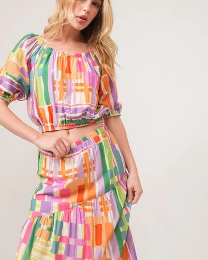 Woman wearing a colorful checkered matching set on a white background