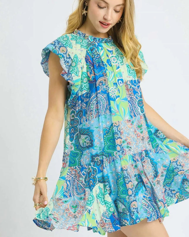 Woman wearing a colorful patterned dress on a white background