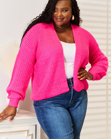 Woman in hot pink ribbed cardigan 