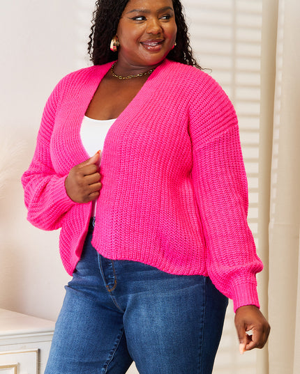 Woman in hot pink ribbed cardigan 