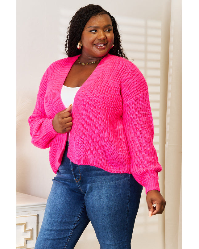 Woman in hot pink ribbed cardigan 