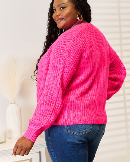 Woman in hot pink ribbed cardigan 